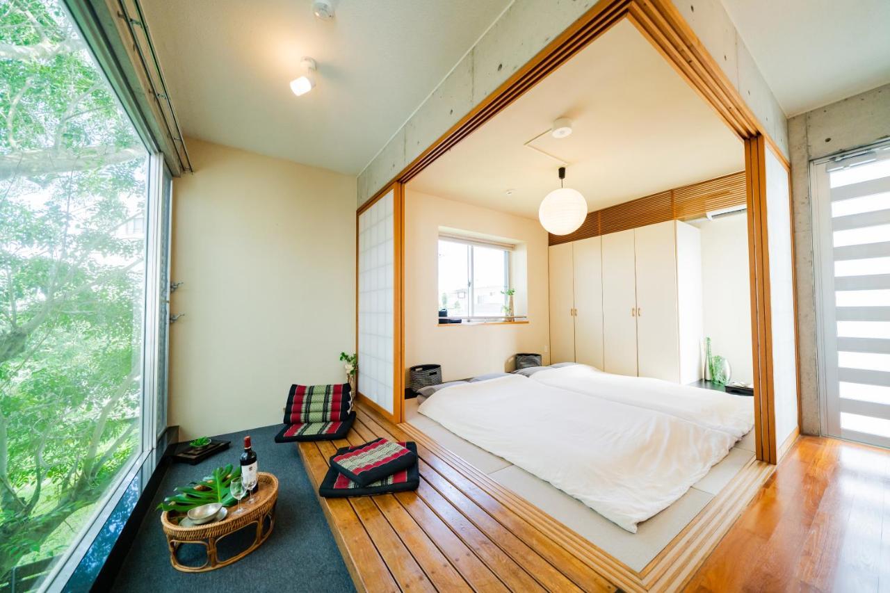 Em Tree House Villa Uruma Eksteriør billede